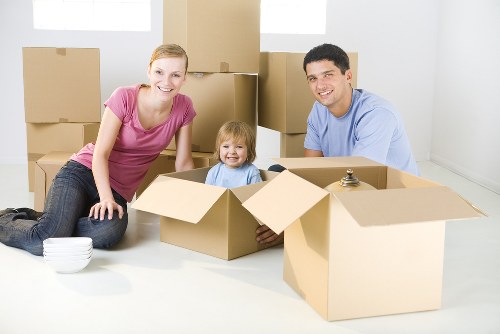 Removal team handling a flat move in Catford with boxes and furniture