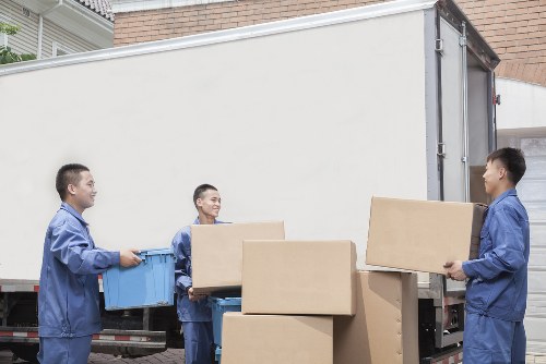 Trained movers using protective equipment during a Catford removal