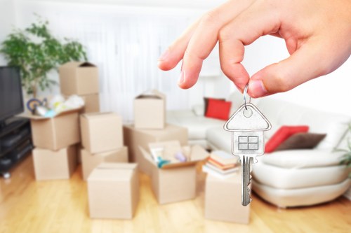 Local movers carefully packing household items for a Catford relocation