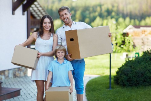Careful loading of household furniture by professional movers in Catford