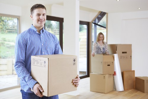 Professional removal van loading household items for a move in Catford