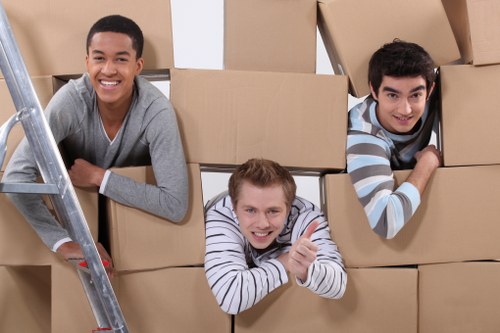 Furniture being carried through a shared stairwell during a flat removal